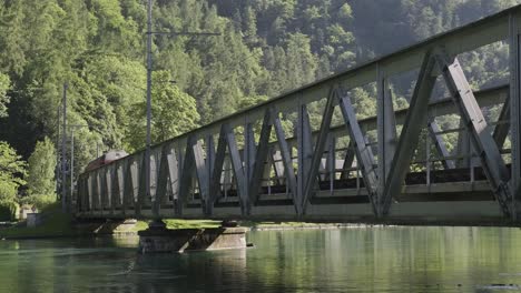 train passing bridge over river aare