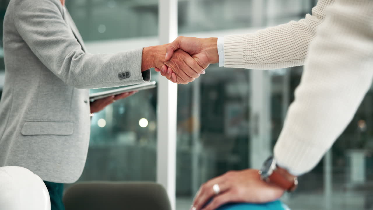 Business Handshake in Office Setting