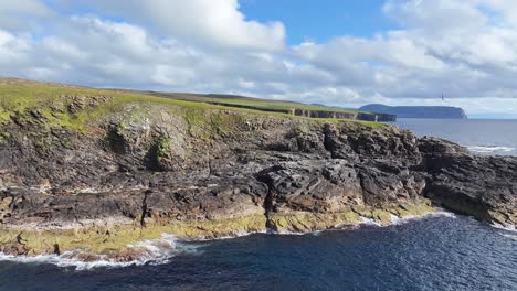 Scenic-Coastline-of-Scotland-UK,-Cinematic-Revealing-Drone-Shot-of-Cliffs-and-Coastal-Landscape-on-Sunny-Day-60fps