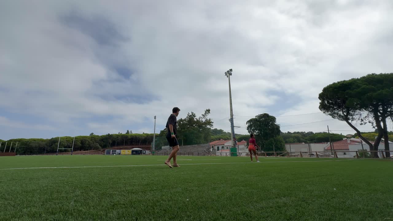 People playing rugby on a field