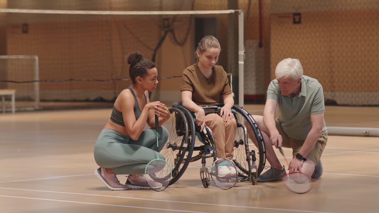 Coach and Athletes Discussing Game Strategy