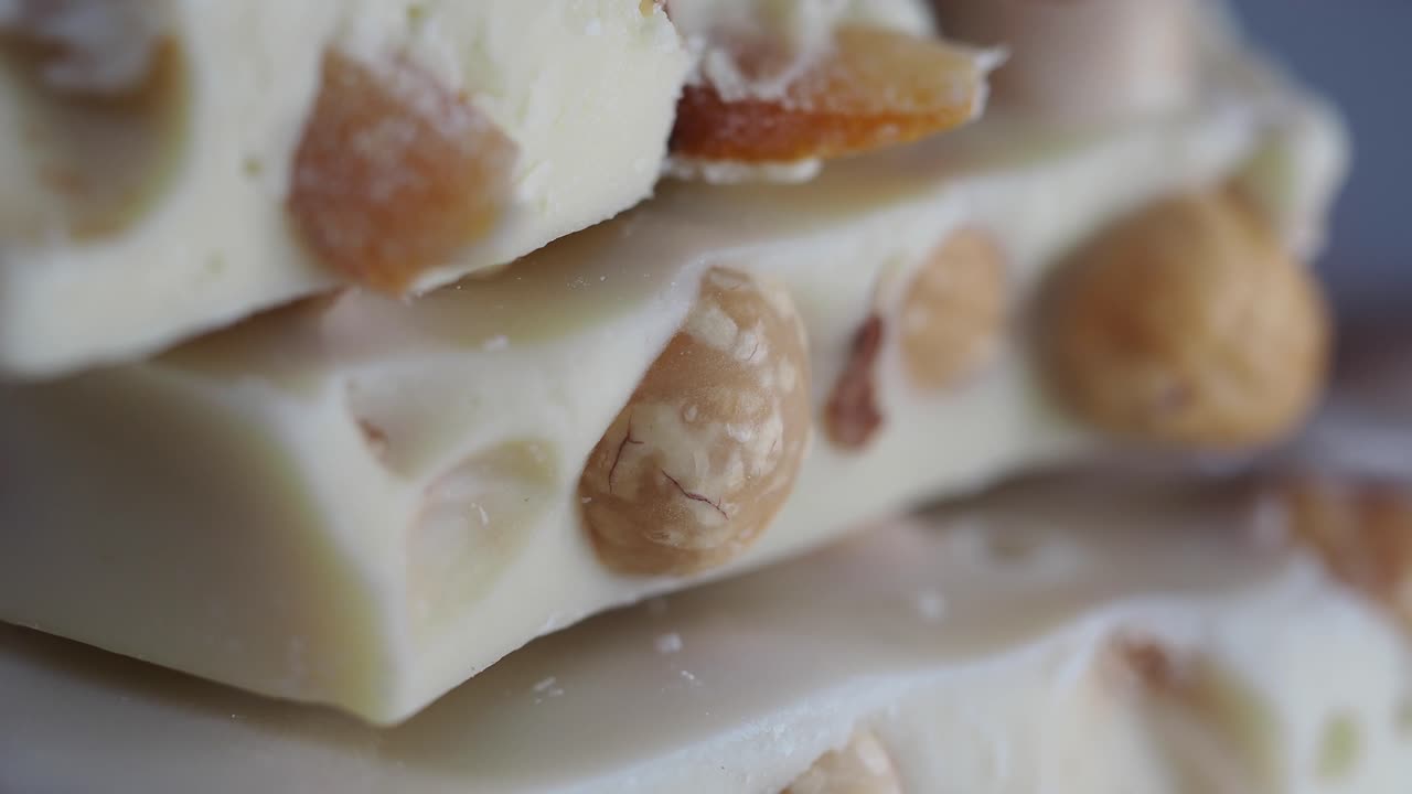 Close-up of White Chocolate Bars with Whole Hazelnuts