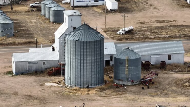 Briggsdale Colorado Grain silo drone shot with focus on the building and surrounding land