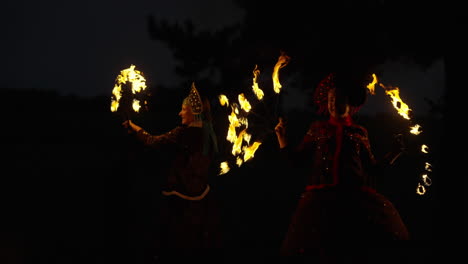 fire dancers at night
