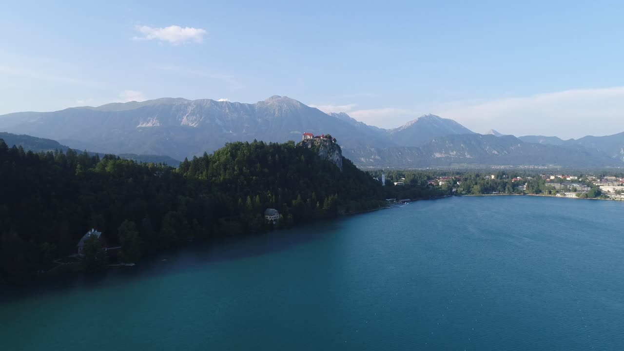 Aerial Drone Fly Above Lake Bled Tourist Destination in Slovenian Alps Natural Green and Blue Unpolluted Atmosphere, Peaceful Water in Summer