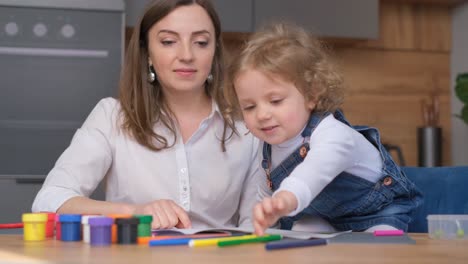 mother and child enjoying a creative drawing session at home