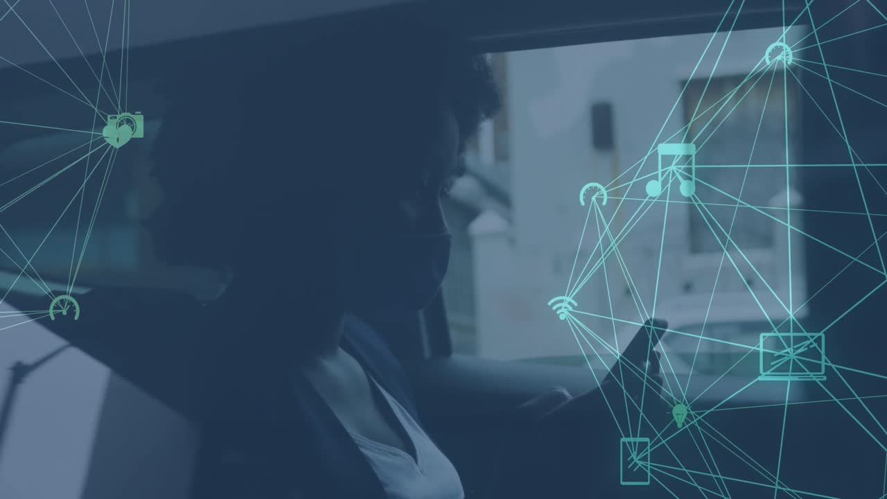 Animation of network of media icons over african american woman using smartphone in car