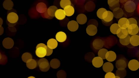 fondo bokeh abstracto, brillante, brillante, luces doradas borrosas. bokeh brillante desenfocado en un fondo oscuro.