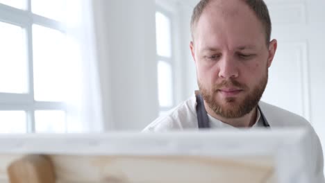 portrait of the artist at work