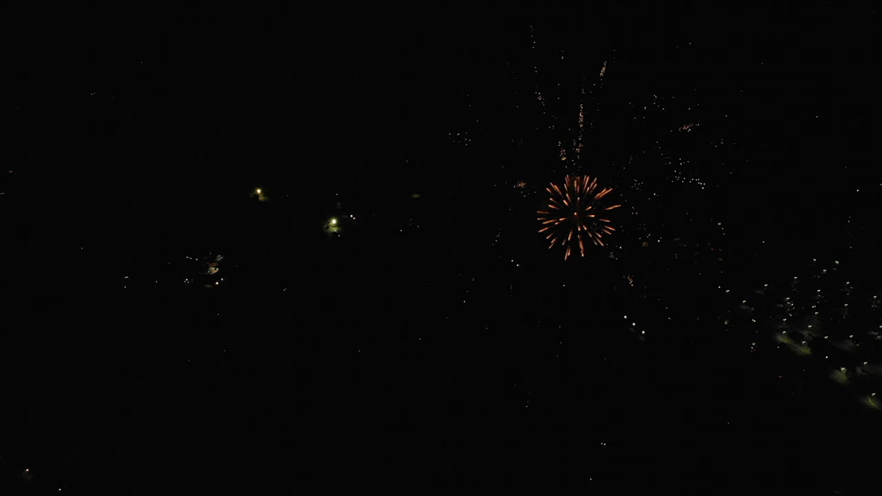 Aerial of Fireworks Over Small Town