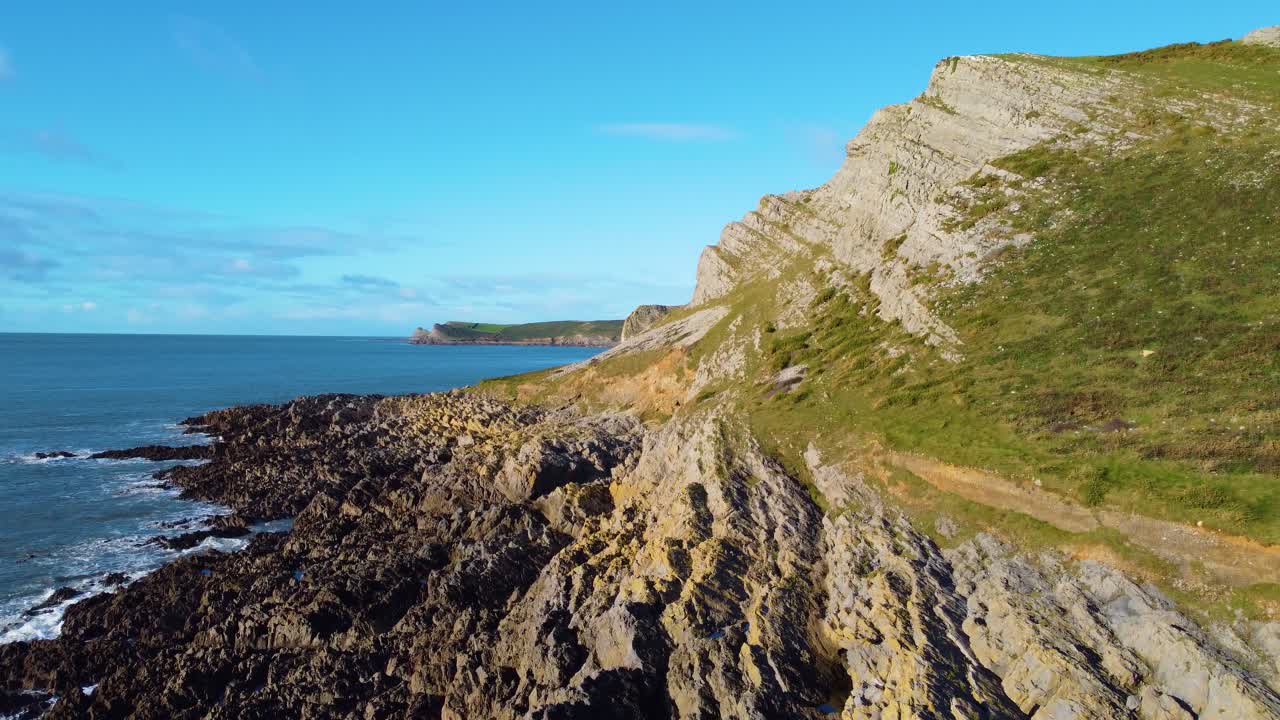 Ascending Drone View Along Rocky Coastline with Open Seascape of Bristol Channel Viewed from Gower. Scenic Tourist Holiday Desintation in Wales
