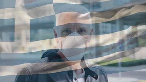 Greece-waving-flag-against-portrait-of-caucasian-senior-man-wearing-face-mask-on-the-street