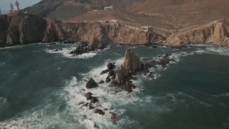 Aerial-circular-view-of-rocky-formation-at-Cabo-de-Gata,-Almeria,-Spain