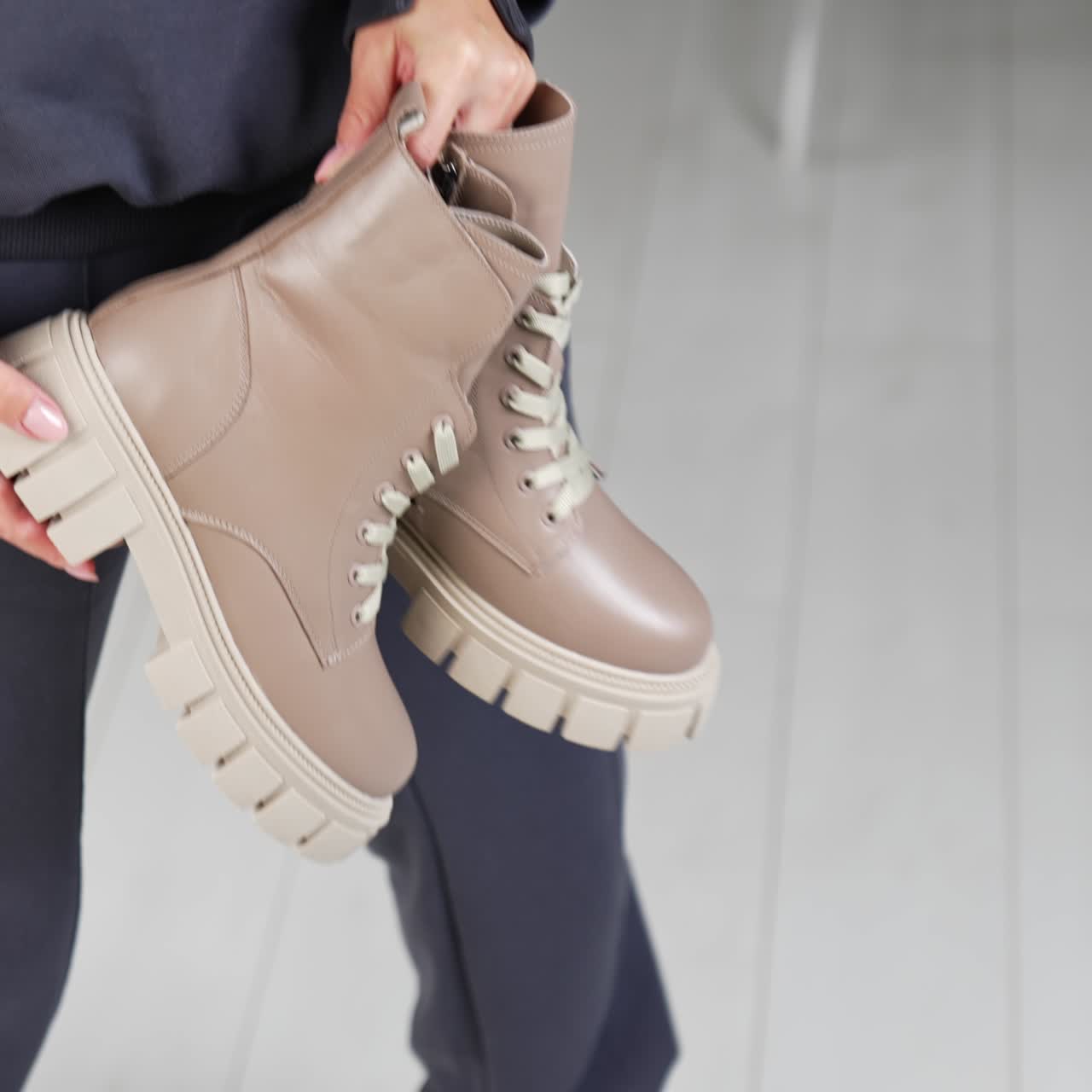 Woman shoe store showroom. Footwear stylish trying in boutique