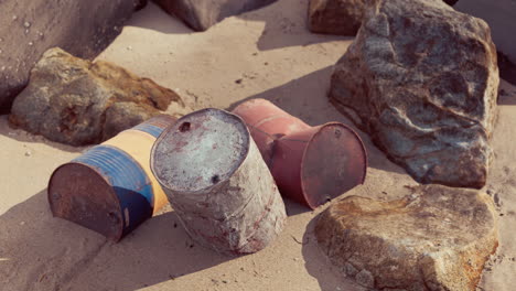 old oil barrell on the sand beach