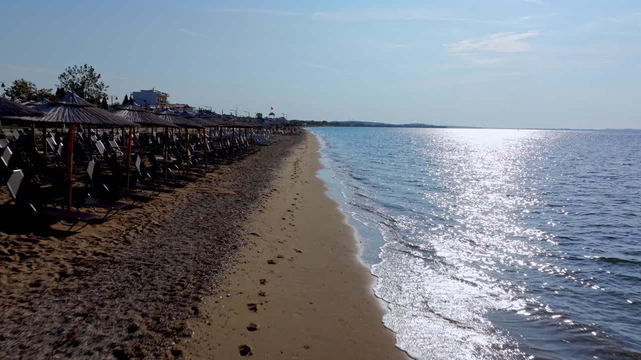 Scenic Beach with Umbrellas and Sparkling Sea