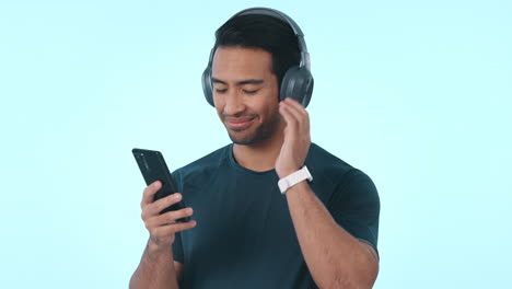 happy asian man, phone and headphones listening to