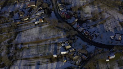 Drone-view-of-city-in-valley-below-mountains