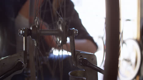 Woman-repairing-and-checking-bicycle-4k