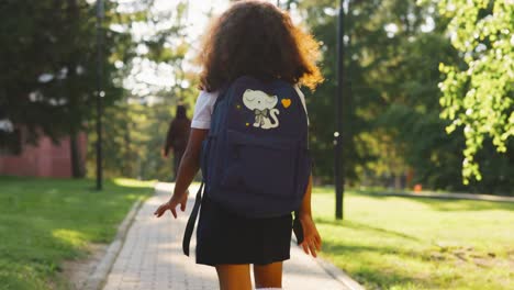 little girl walking to school