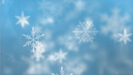 Snowflakes-moving-against-blue-background