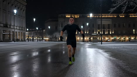 man running in snowy city at night