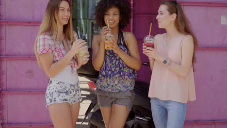 friends having drinks in street