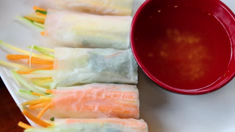 spring rolls gradually disappear with dipping sauce