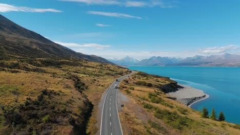 camper van road trips across new zealand driving along lake pulak, aerial