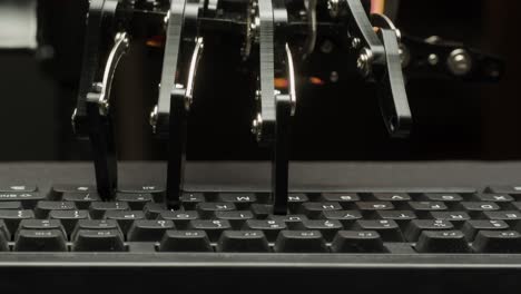 robot hand typing on a keyboard