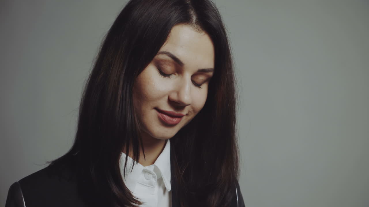 Portrait of a young beautiful brunette with a beautiful make up