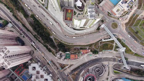 Aerial-shot-of-Downtown-Hong-Kong-mega-residential-skyscrapers-and-traffic,-on-a-beautiful-day