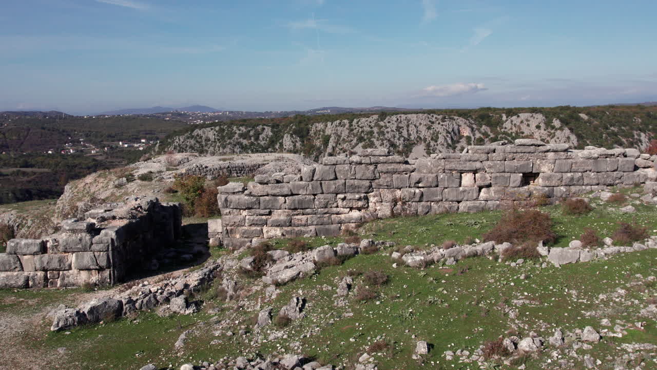 Aerial view of Daorson ruins near Stolac, showcasing ancient Illyrian stone walls and dramatic rocky landscape under a clear sky