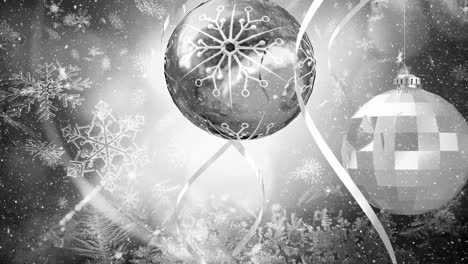 Animation-of-snow-falling-over-silver-christmas-baubles-decorations
