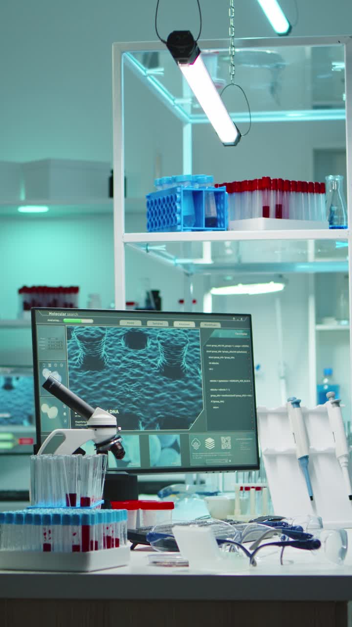 Vertical video: Interior of modern science laboratory with no people at night