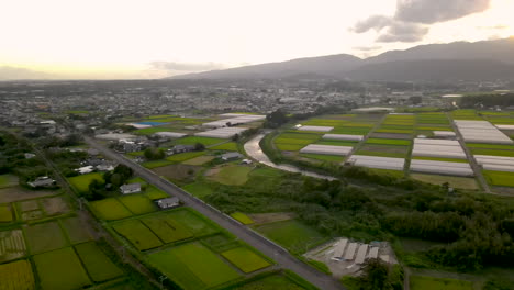 aerial over farms and fields near tsuno, kyushu, japan