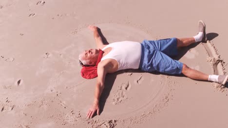 an elderly man making the sign angel