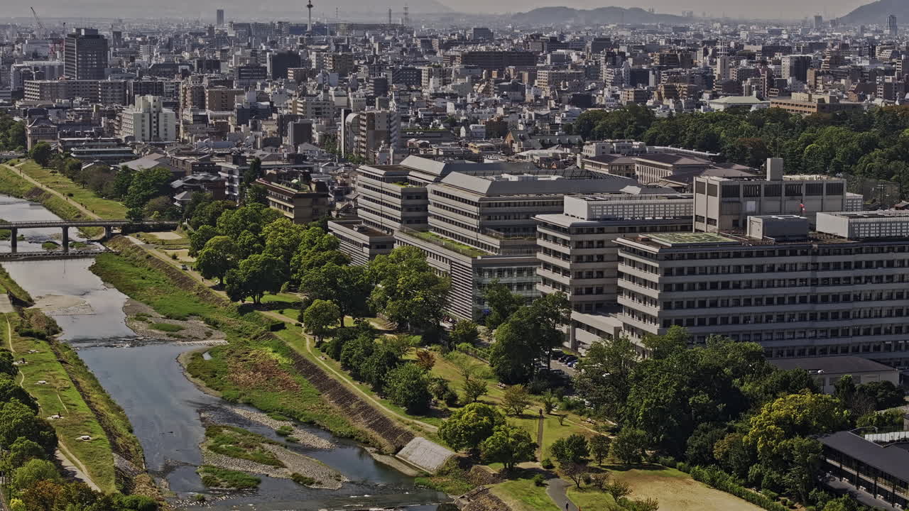 Kyoto Japan Aerial v55 zoomed birds eye view flyover Kamogawa Delta capturing Kajiicho district, Kamo river, riverside parks and cityscape of Kamigyo ward - Shot with Mavic 3 Pro Cine - Oct 8th 2023