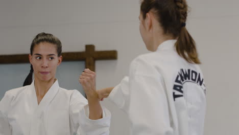 two women practising punches