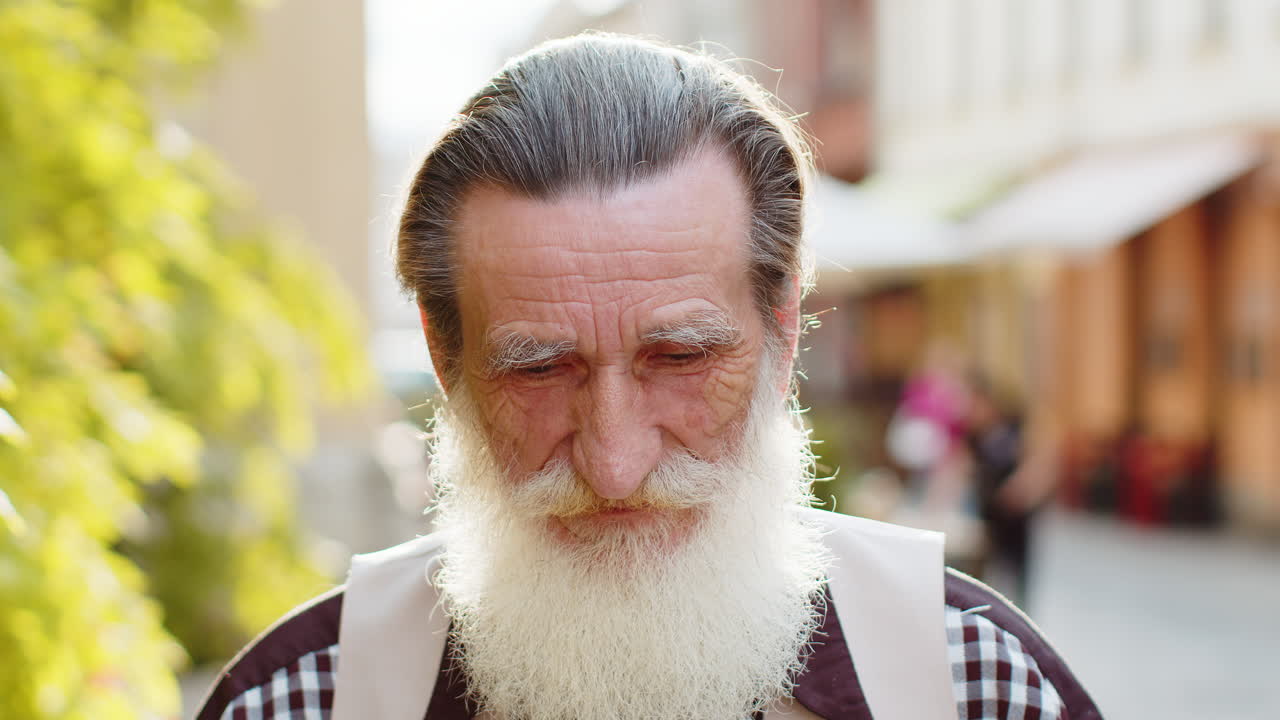 Happy senior man smiling looking away dreaming resting good news feel satisfied in city street