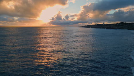 aerial calm marine sunrise over endless ocean. sea surface reflecting light