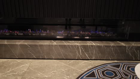 a modern fireplace with blue flames