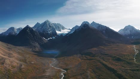 an aerial approach to a blaisvatnet blue lake in langealpen valley in norway