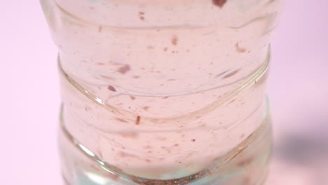 close up of dirty water in a plastic bottle