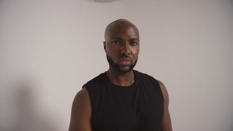 full length studio shot of male basketball player dribbling and bouncing ball against white background 1