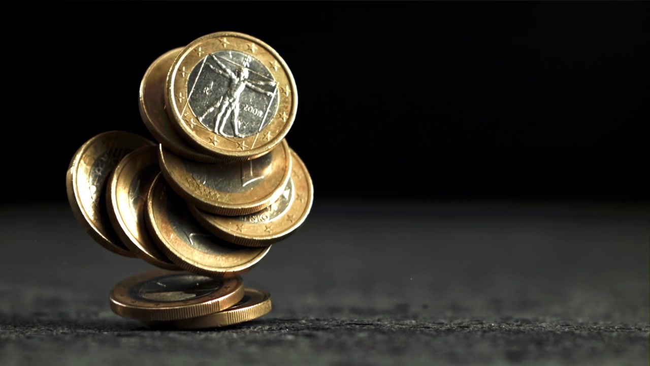 Stack of Euro Coins Falling and Collapsing in Slow Motion