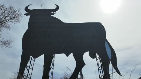 extreme closeup view of a spanish black bull abandoned billboard