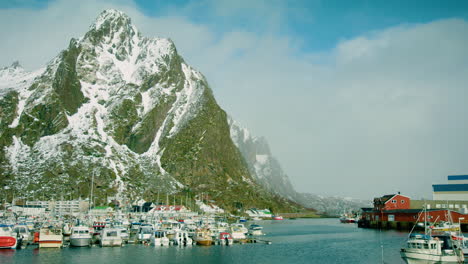 cinematic wide shot of boats in svolvaer harbour, lofoten, norway