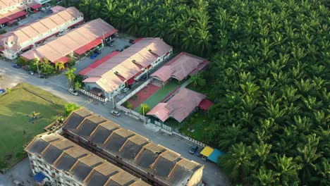 birds eye view aerial flyover residential kampung china neighborhood, seri manjung, sitiawan, hectares of palm tree commercial business plantations, malaysia rank top among global market suppliers