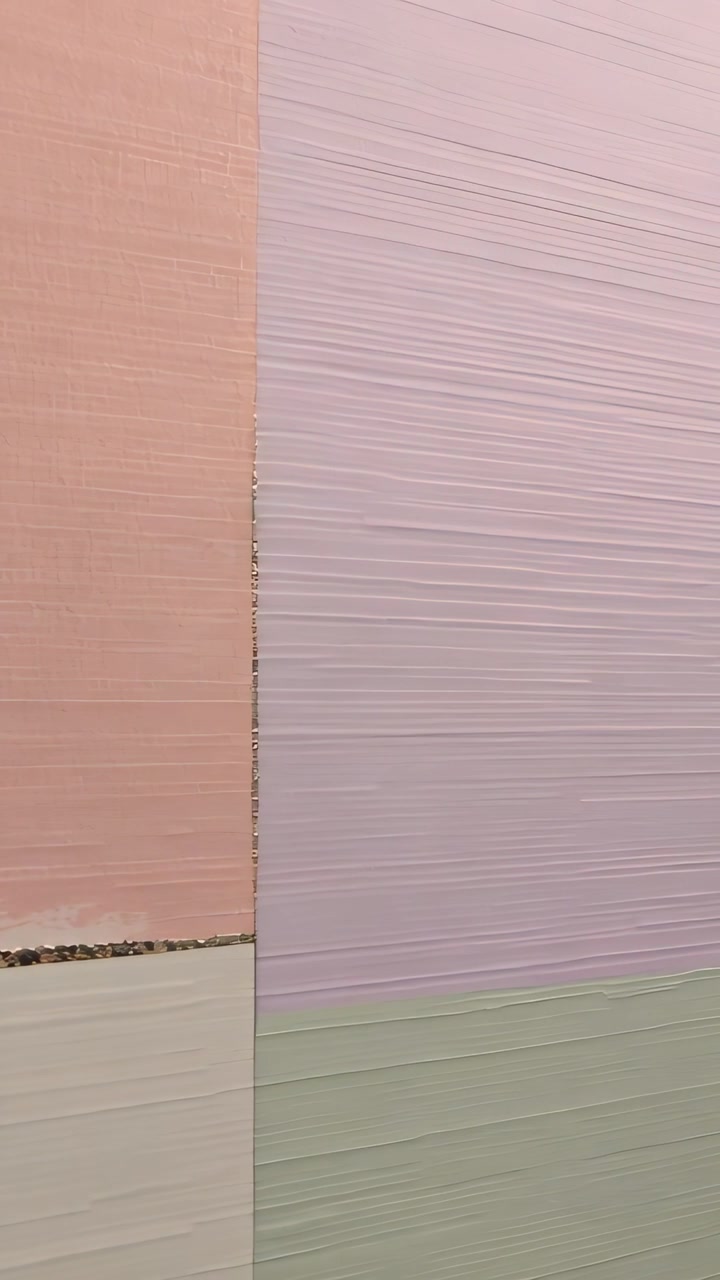 Vertical video: Panning slowly camera holding seam on outdoor wall, showing peach lilac panels